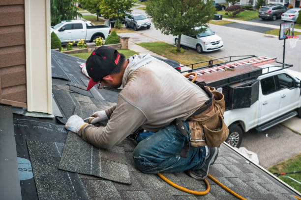 Professional Roofing technician working in North Chelmsford, MA